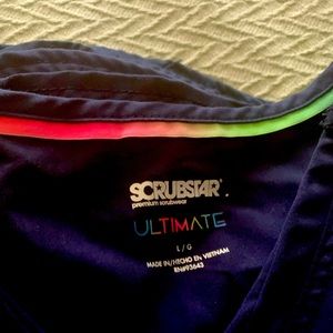 Stars scrubs navy blue large shirts and pants. 4 of each